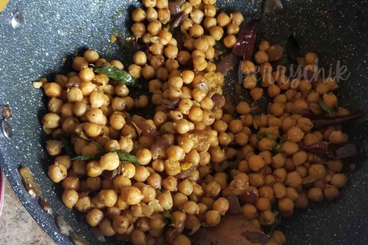 close up image of chickpea stir fry on a wok