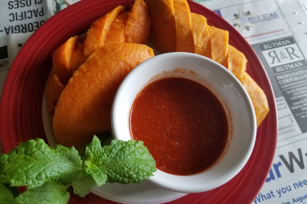 Close‑up of boiled sweet potato showing soft, creamy interior.