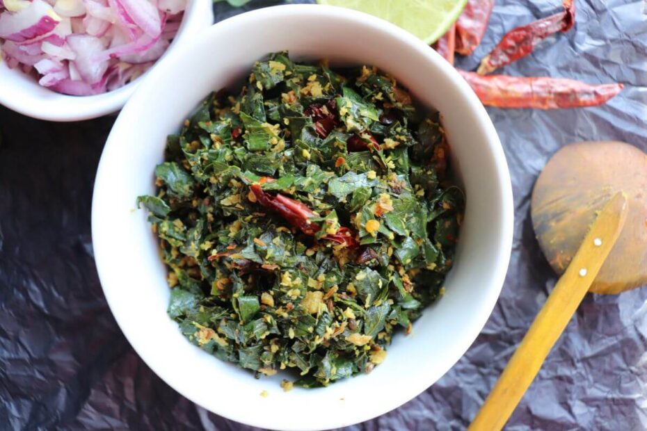Close-up of cooked Agathi keerai showing tender greens mixed with coconut.