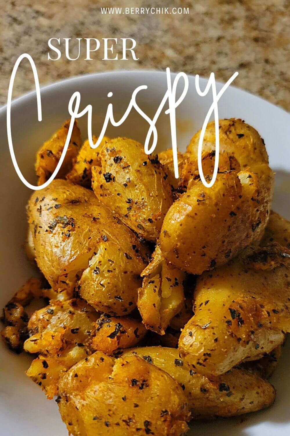 Freshly air‑fried smashed potatoes inside an air fryer basket.  