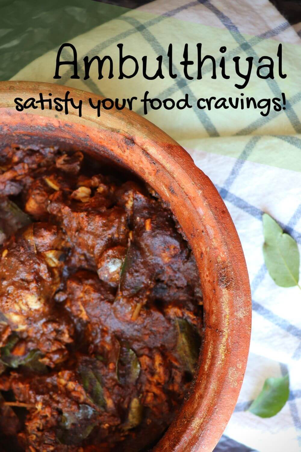 Ambul Thiyal ready and presented in a earthy clay pot ready to be served with rice, showing the rich tangy Sri Lankan fish curry