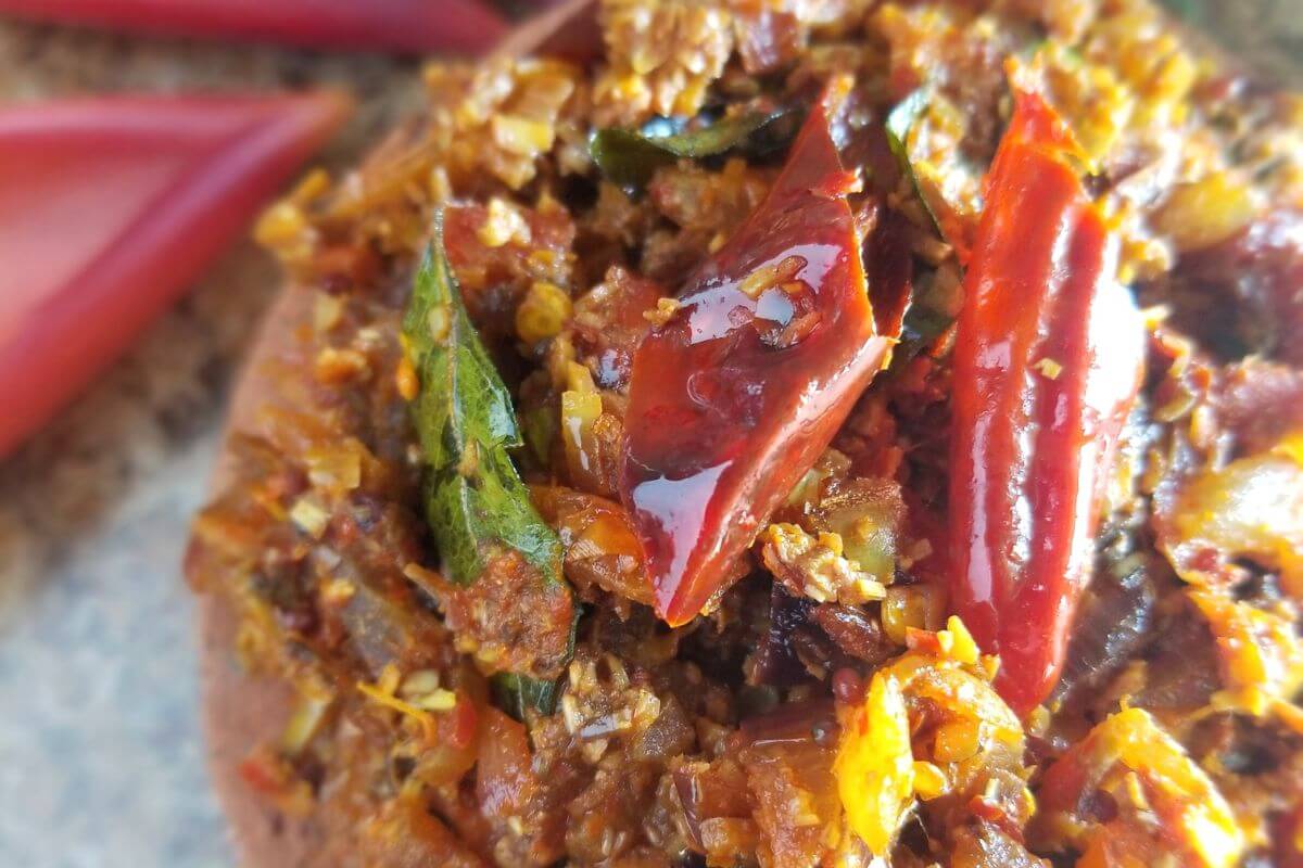 recipe blog post featuring banana flower stir fry in a clay pot ready to be served