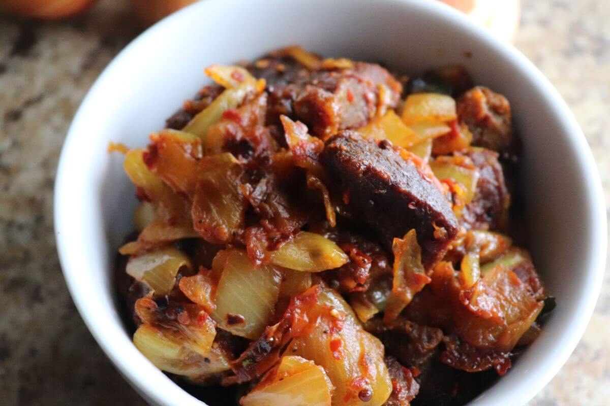 Beef onion sambal ready to be served with rice as a Sri Lankan comfort meal.