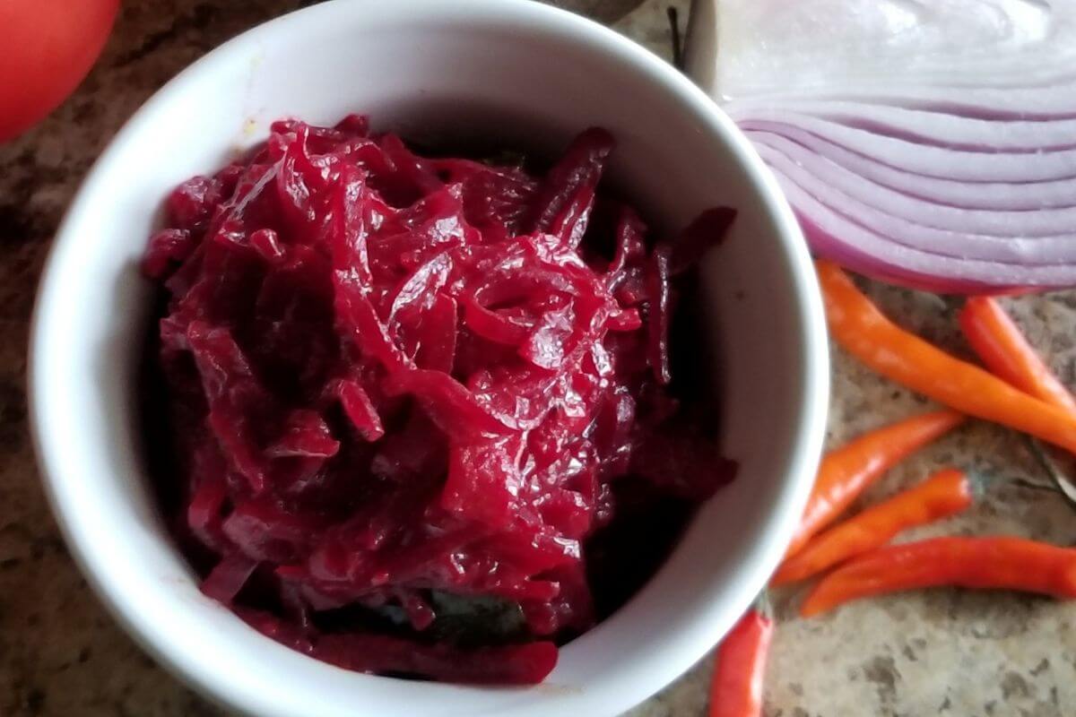 Beetroot curry in a bowl with coconut milk, vibrant red and creamy.