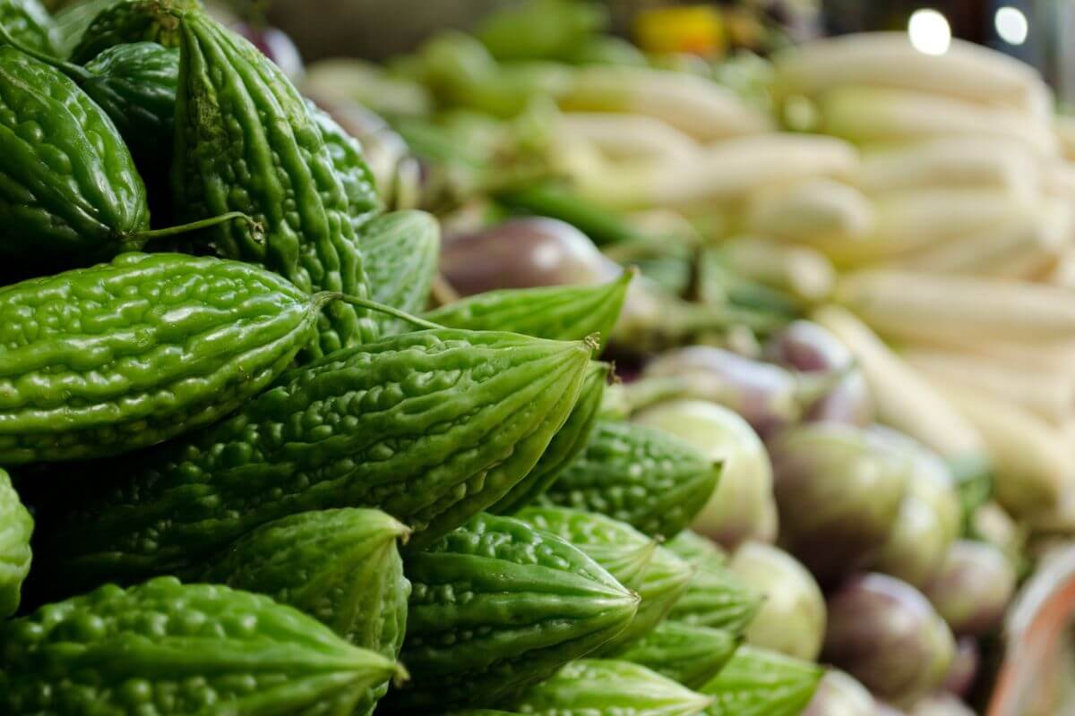 bitter melon vegetable stacked in a table at the grocery store