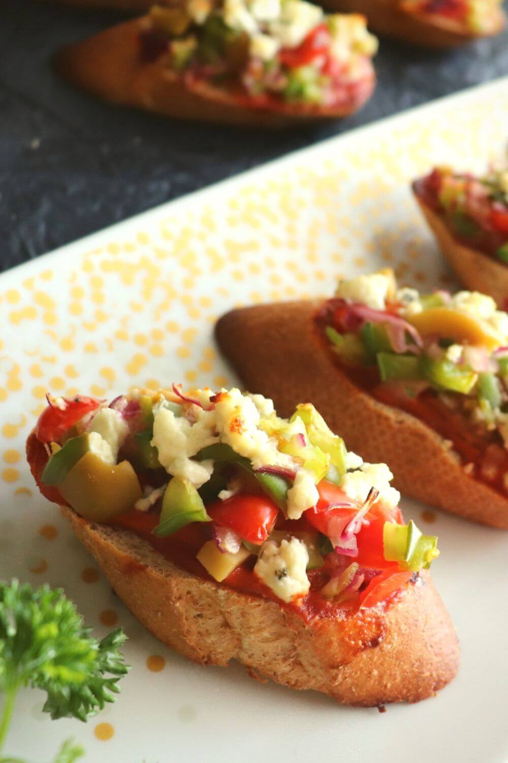 close-up image of a single Spiced bruschetta fusion arranged on a white plate