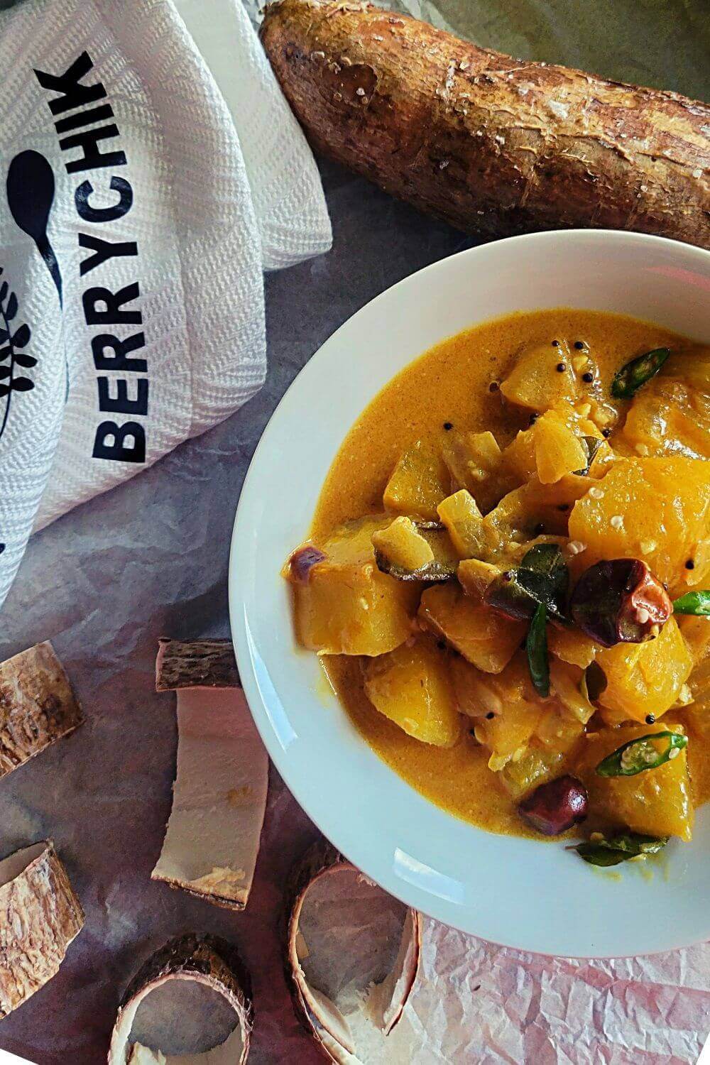 a pin image featuring Cassava curry ready to be served as part of a rice and curry meal.