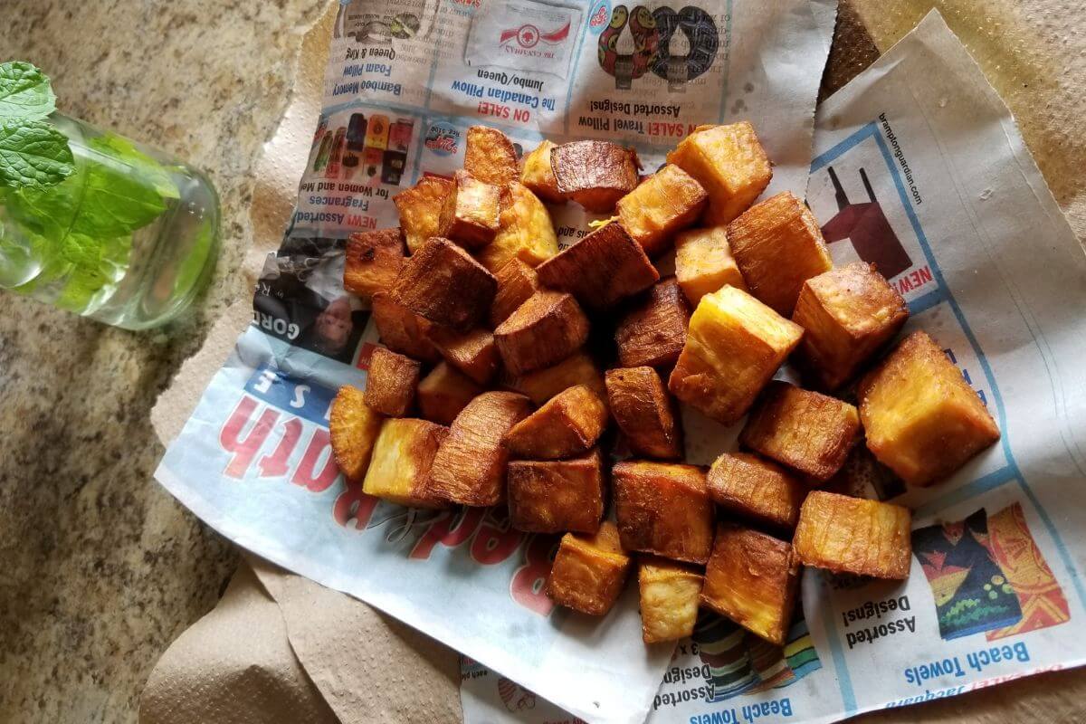 Close‑up of crispy deep fried cassava with golden edges.