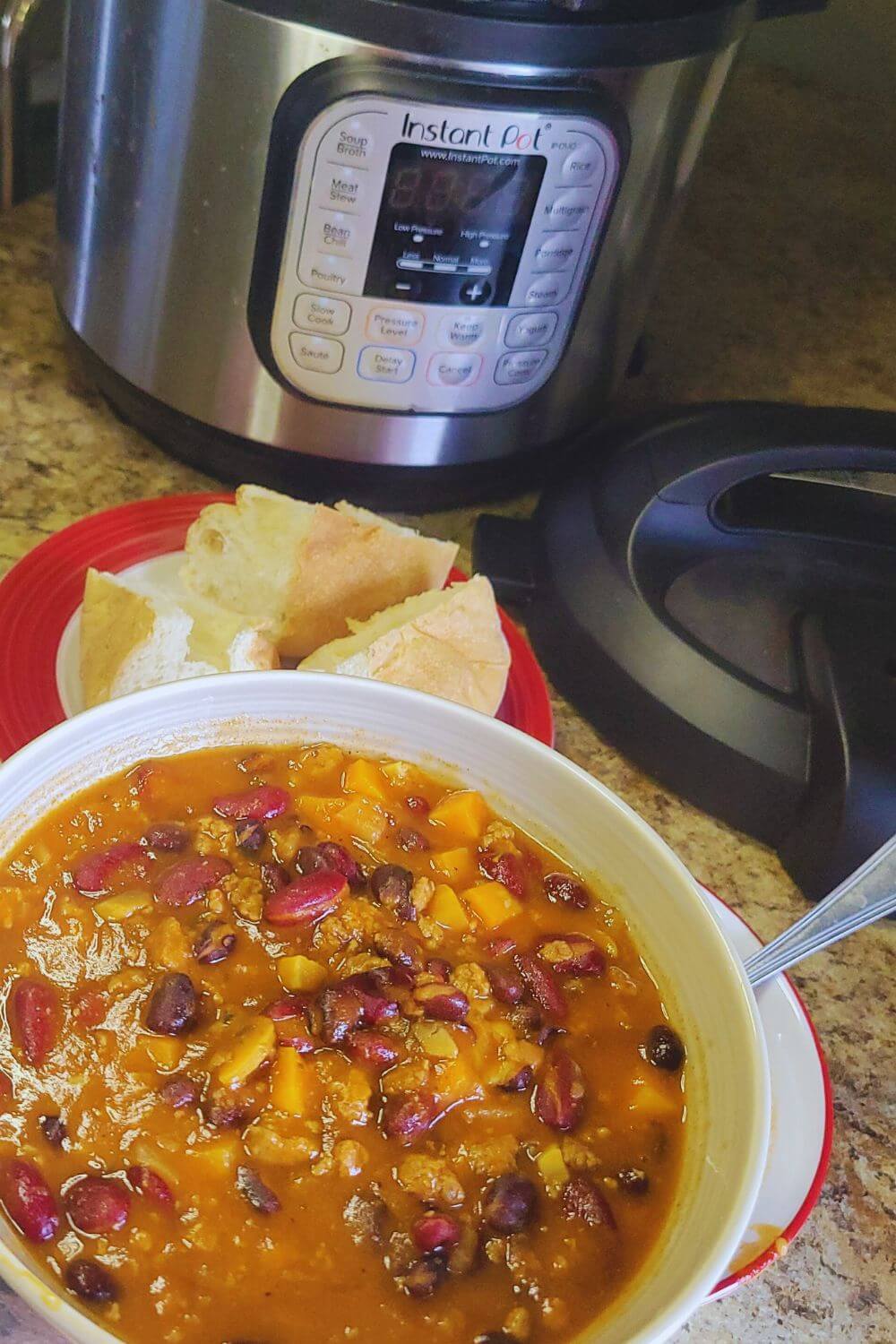 Side view of Instant Pot chili in a bowl showing its thick, hearty texture. 