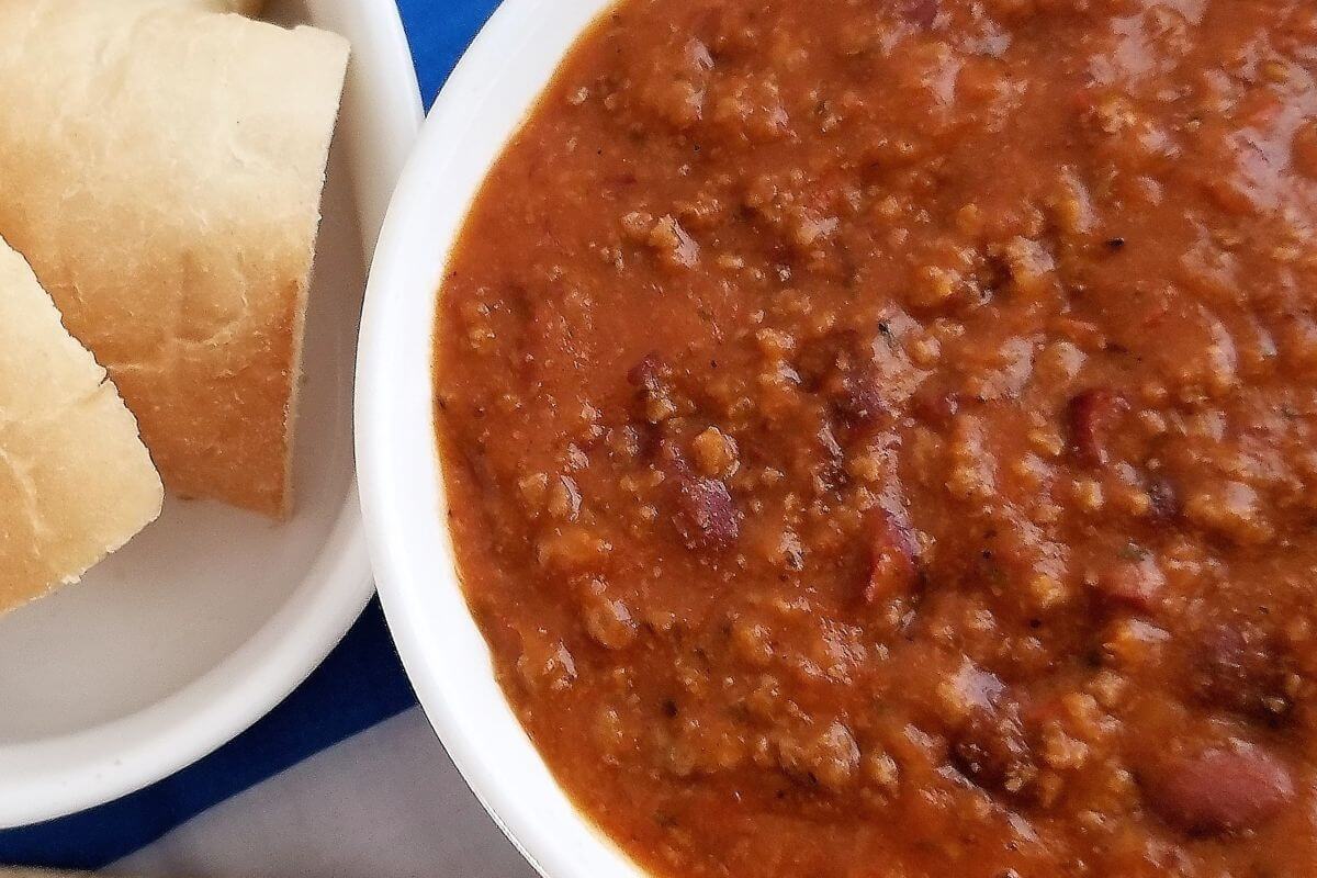 Close‑up of one‑pot chili showing beans, meat, and spices.