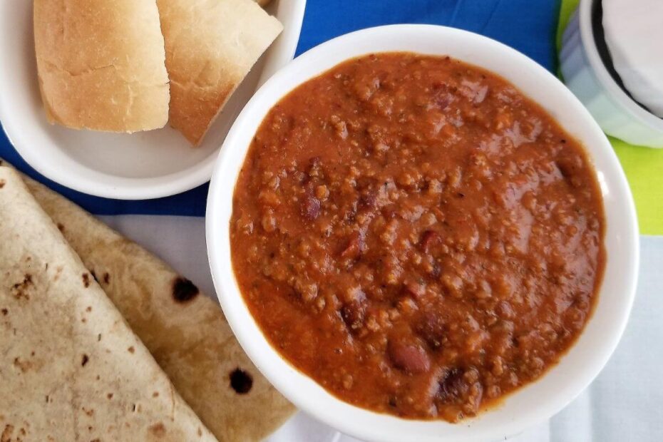 Bowl of one‑pot chili served with a spoon, ready to enjoy.