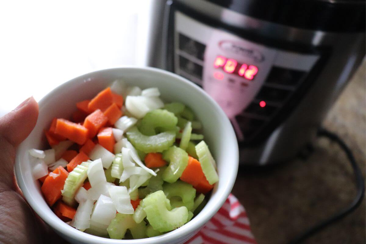 Close-up of the ingredients for pressure cooker chili showing beans, meat, and spices.