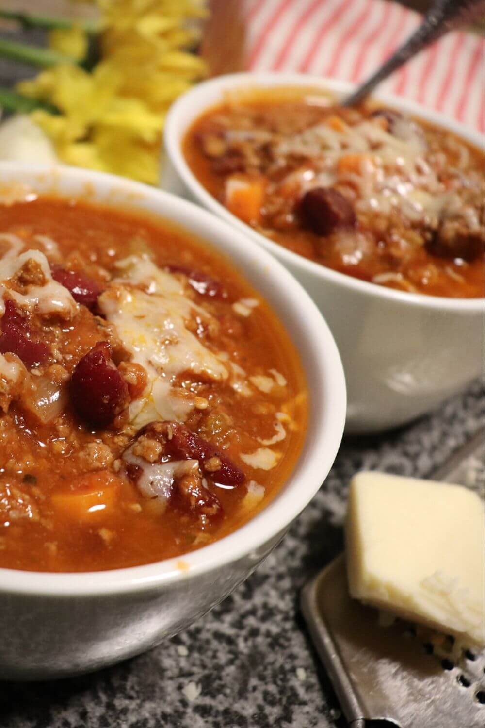 Bowl of power pressure cooker chili served with a spoon, ready to enjoy.