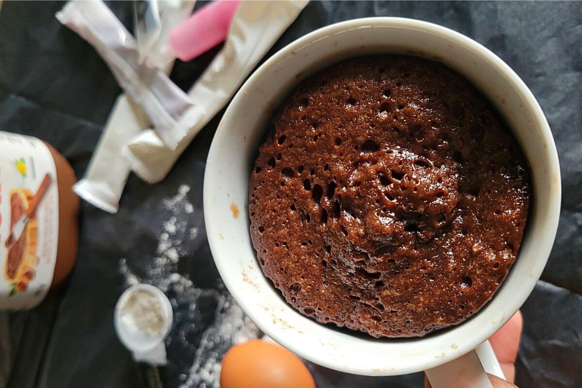 Freshly made Nutella mug cake served warm in a mug.