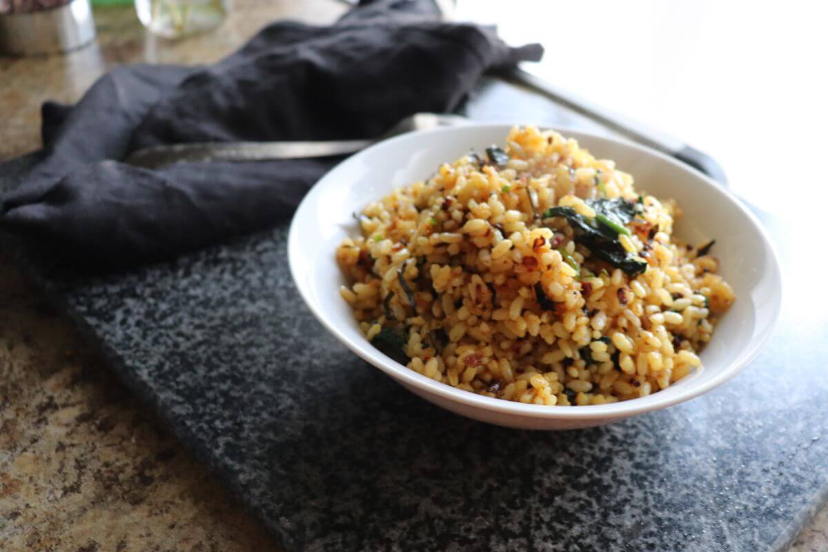side angle of the spinach rice plated on a white bowl