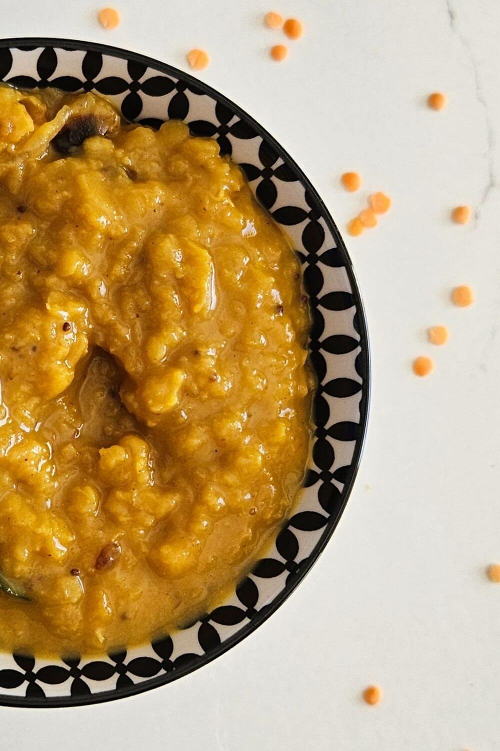 A pin image featuring a Sri Lankan parippu just off the stove plated and ready