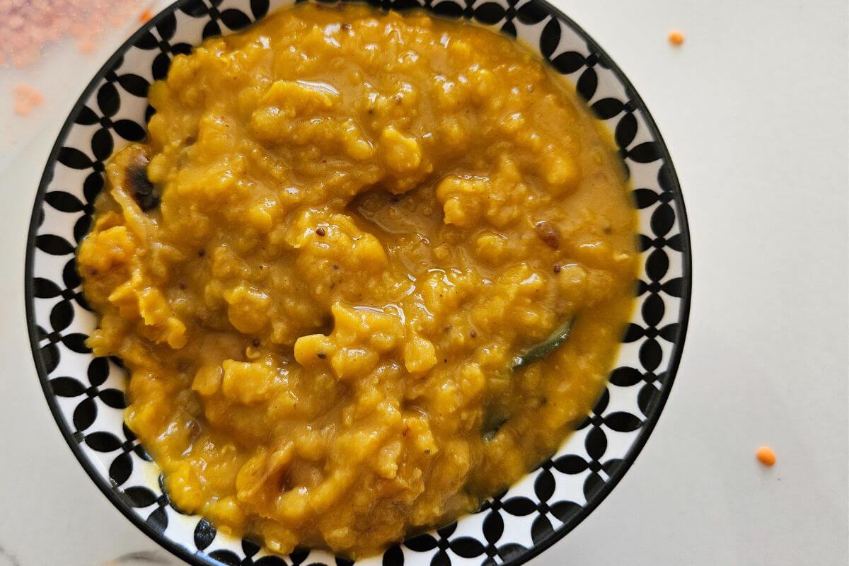 A hero image of Sri Lankan parippu just off the stove plated and ready