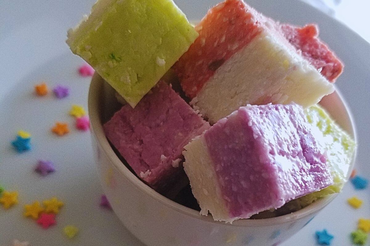coconut ice made into a vegan treat plated on a white bowl