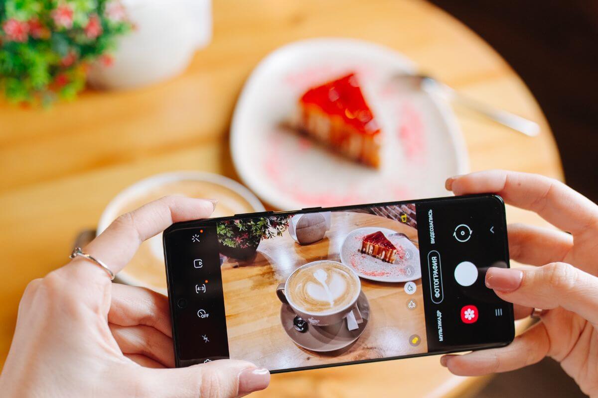 using a phone to capture a photo of a plated food to to start a food blog