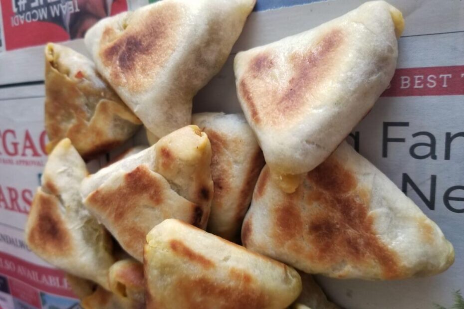 handful of bite-size sri lankan fish roti scattered on a paper