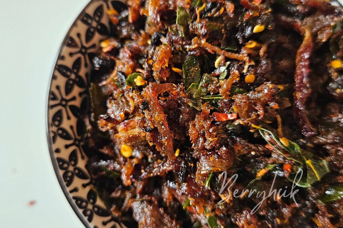 closeup view of sri lankan pulled beef fry in a bowl