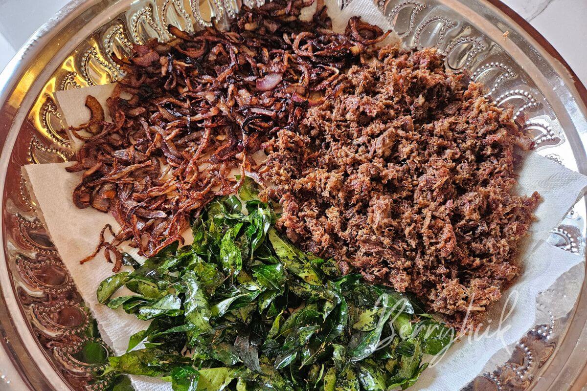 tray of three essential ingredients deep fried and kept to cool down in order to make pulled beef fry
