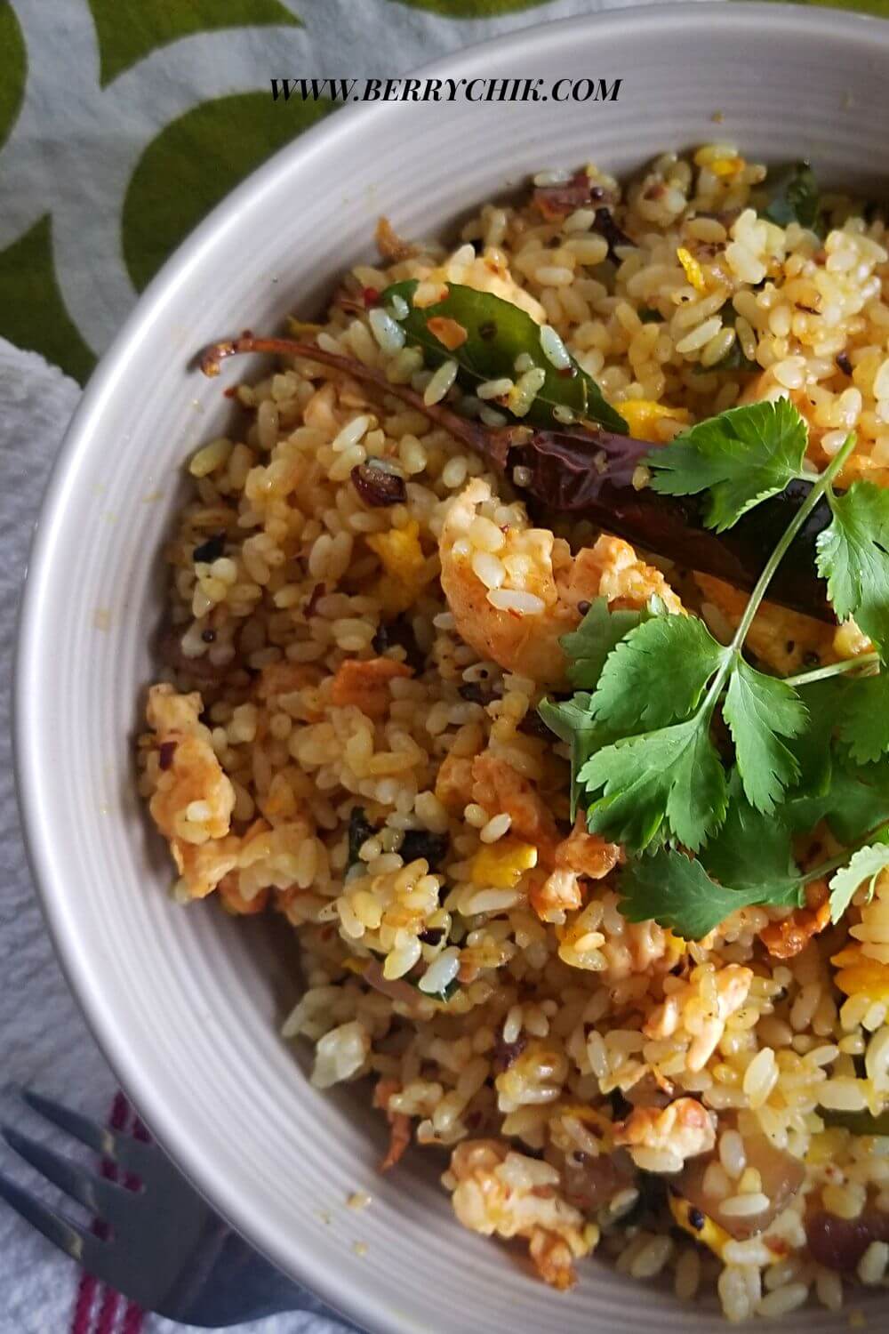 pin image of egg rice made with sri lankan flavour, platted and garnished to enjoy