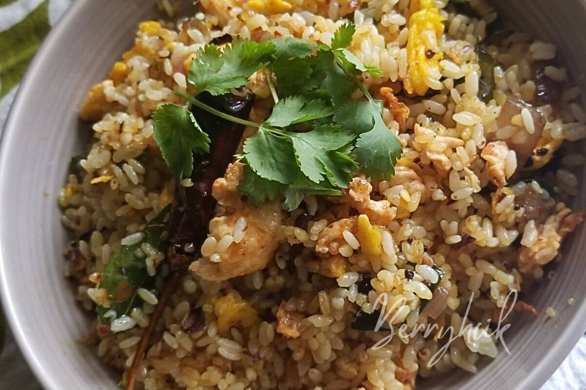 closeup view of tempered egg rice made with spices to enhance flavours