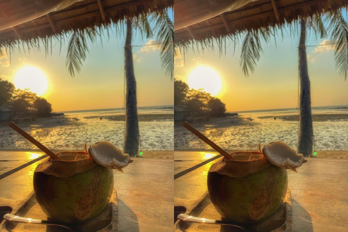 Fresh young coconut cut open with a straw inserted, ready to drink the coconut water.