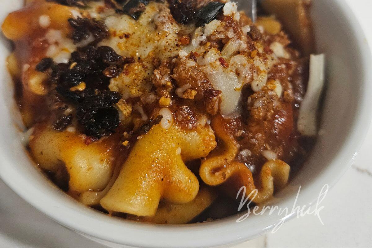 plated and garnished lasagna in a bowl made from one pot