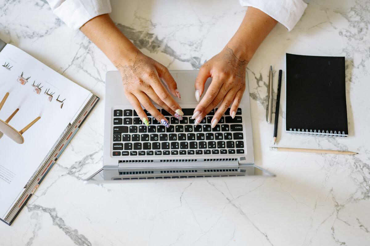 Person customizing WordPress settings on a laptop while working from home