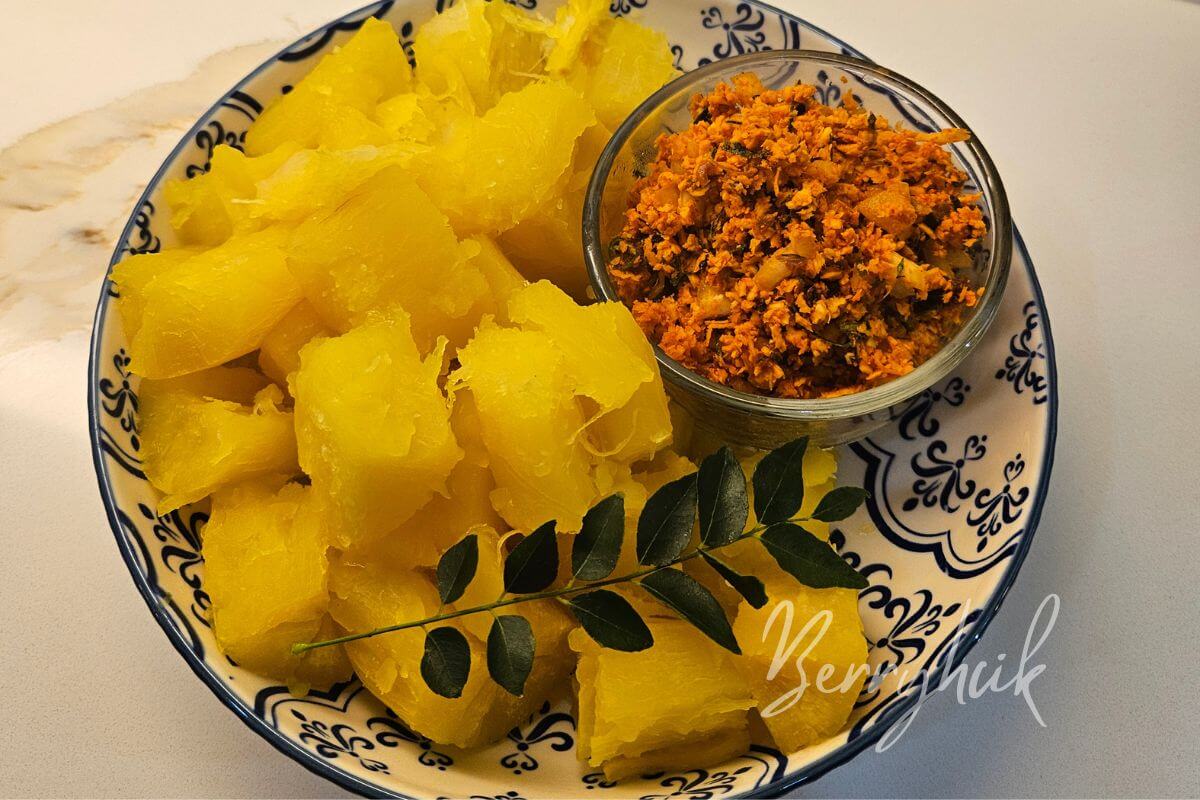 Top view of boiled cassava served with coconut sambal.