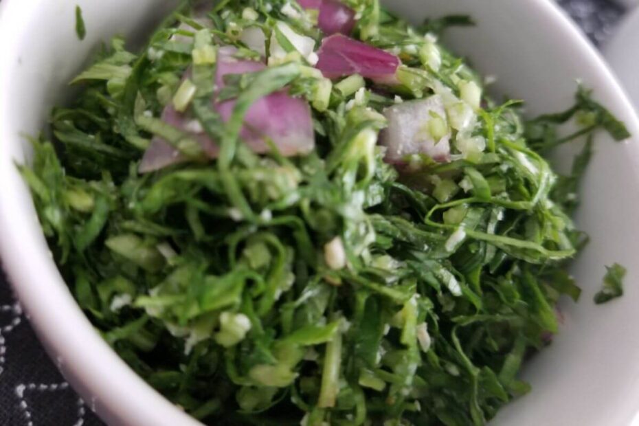 Overhead view of Sri Lankan gotu kola sambol with coconut, lime, and chili — fresh herbal salad packed with skin‑boosting nutrients.