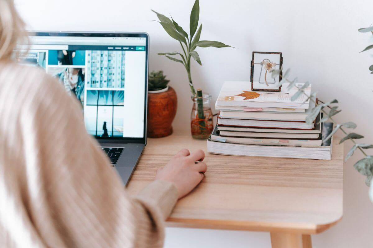 WordPress Pages dashboard open on a laptop in a home office setting