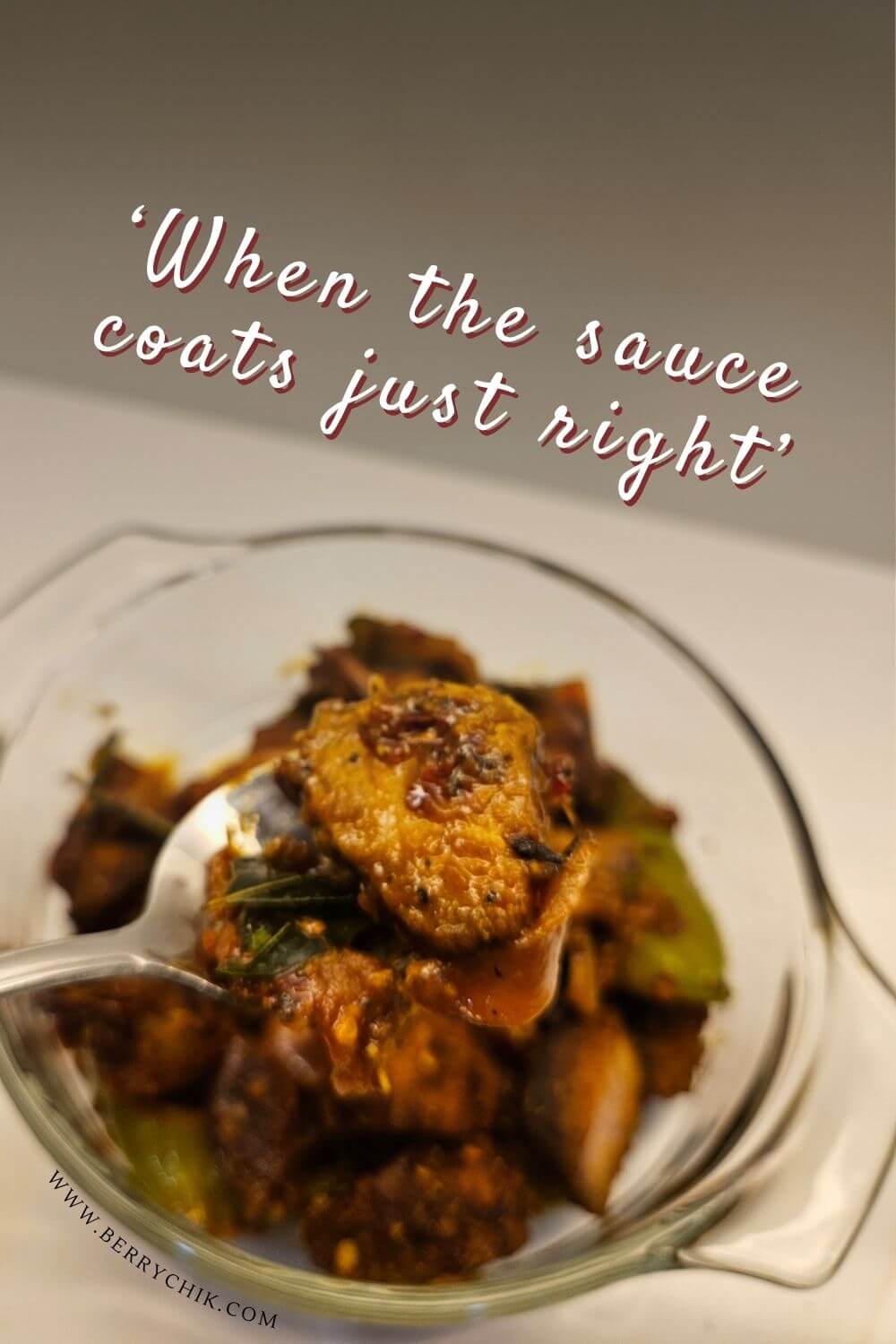 Sri Lankan deviled fish served in a bowl with onions, peppers, and curry leaves, styled for Pinterest.