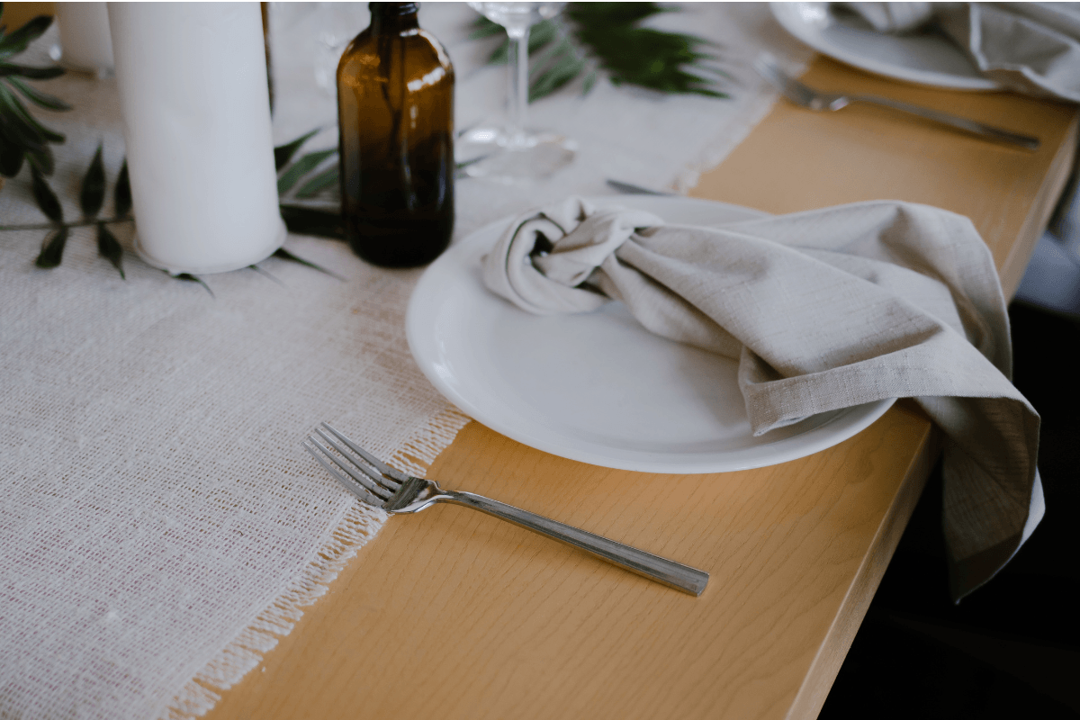 empty plate on a dinner table without any idea what's for dinner