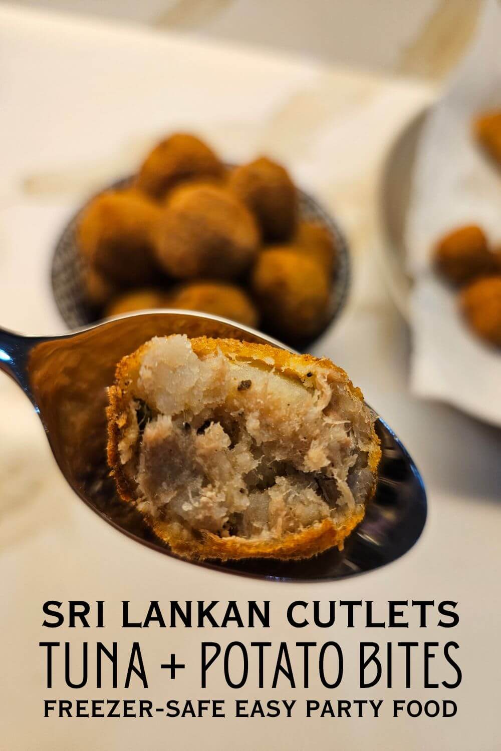 pin image of a half fish cutlet in a spoon with more sri lankan fish cutlets in a bowl in the background